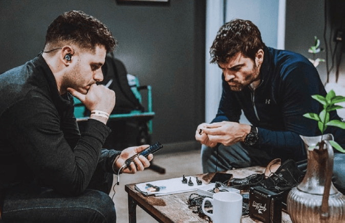 Glendinning pictured right preparing his JH Audio IEMs