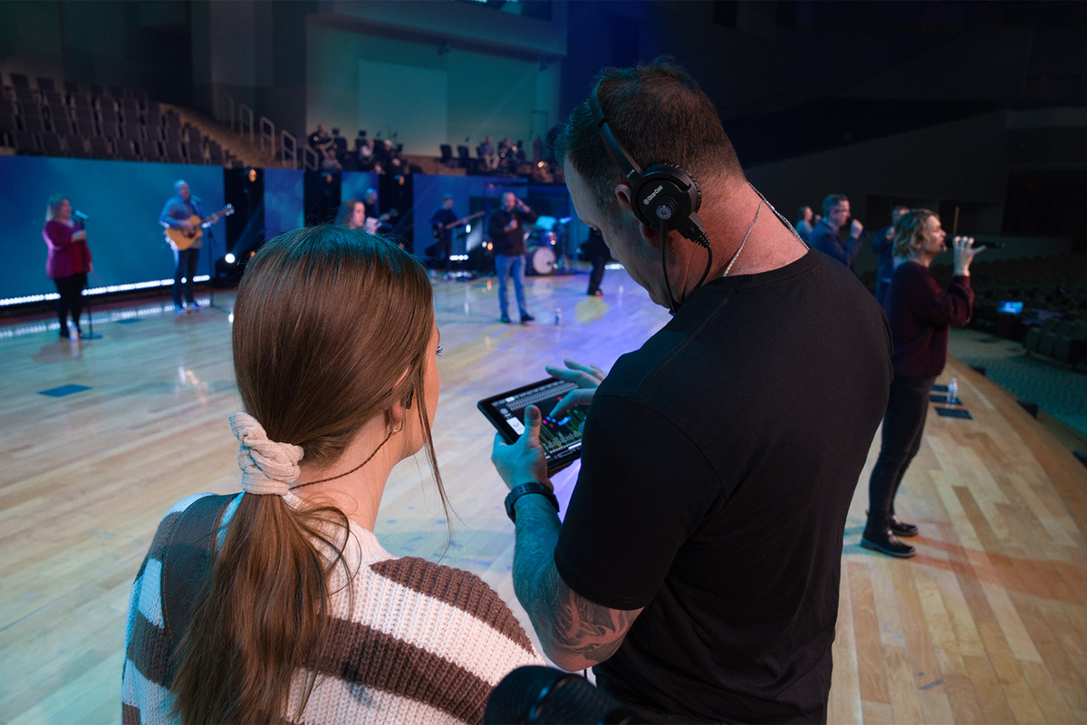 &nbsp;FBCW Stage Manager Lantz Cleveland helps one of the worship team vocalists dial in her IEM mix on an iPad running KLANG:app